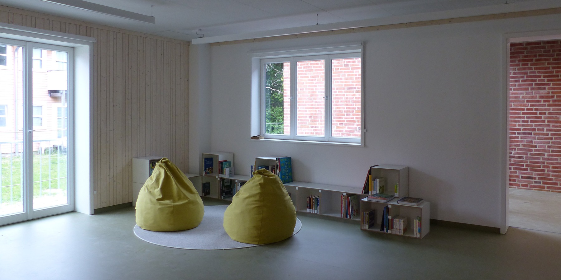 Kinderspielecke im Erdgeschoss des Bestandsgebäudes © 2026 SBL Greifswald